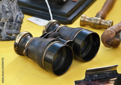 Old historical binoculars as a decoration on a table