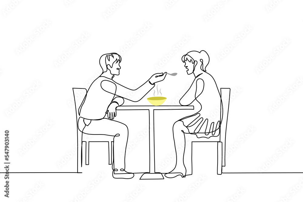 man feeding a woman from a spoon - one line drawing vector. concept the guardian feeds the broth to the sick patient; flirting or treating sweetheart