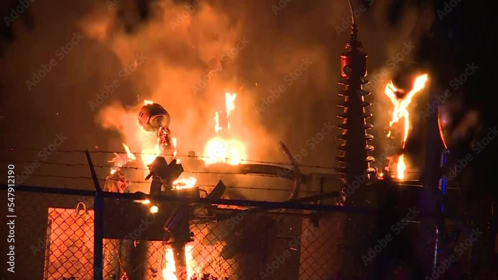 CU OF TRANSFORMER SUBSTATION ON FIRE AT NIGHT