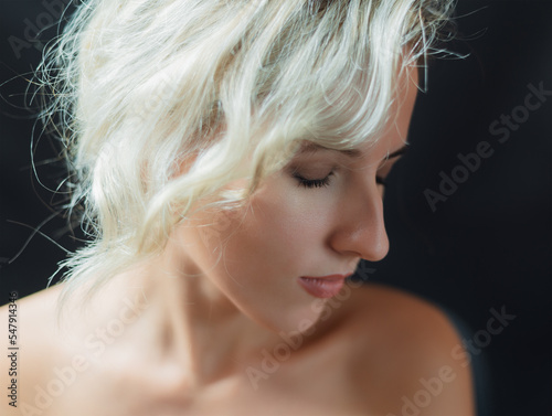 Portrait of beautiful sensual woman with closed eyes. Studio shot.