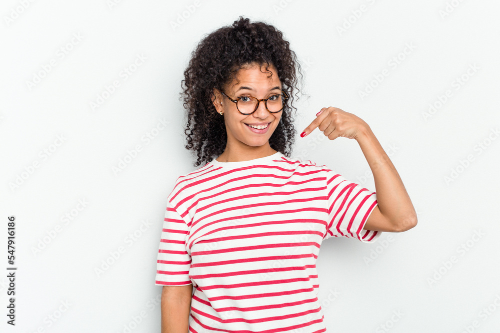 Young african american woman isolated person pointing by hand to a shirt copy space, proud and confident Young african american woman isolated person pointing by hand to a shirt copy space, proud and confident
