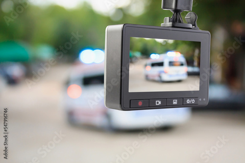 Car CCTV camera video recorder with ambulance car on the road