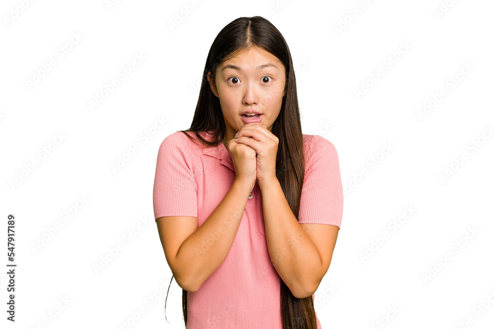 Young Asian woman isolated praying for luck, amazed and opening mouth looking to front. Young Asian woman isolated praying for luck, amazed and opening mouth looking to front.