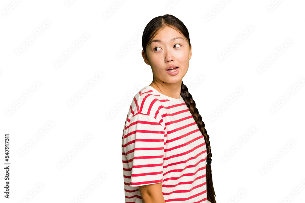Young Asian woman isolated looks aside smiling, cheerful and pleasant. Young Asian woman isolated looks aside smiling, cheerful and pleasant.