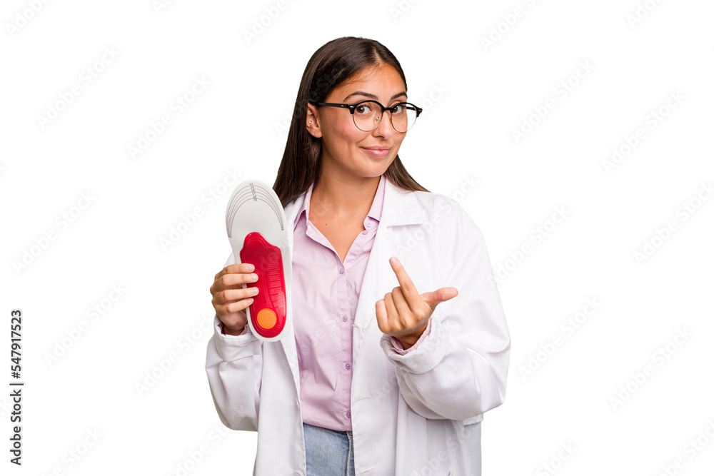 Young caucasian podiatrist woman isolated pointing with finger at you as if inviting come closer. Young caucasian podiatrist woman isolated pointing with finger at you as if inviting come closer.