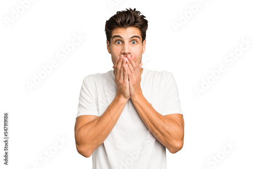 Young caucasian handsome man isolated shocked covering mouth with hands.