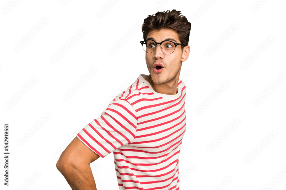 Young caucasian handsome man isolated looks aside smiling, cheerful and pleasant. Young caucasian handsome man isolated looks aside smiling, cheerful and pleasant.
