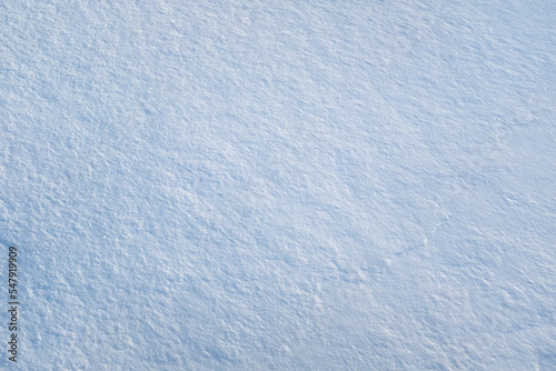 Snow background, top view. Fresh snow texture. Winter backdrop for publication, poster, screensaver, wallpaper, postcard, banner, cover, post. High quality photo