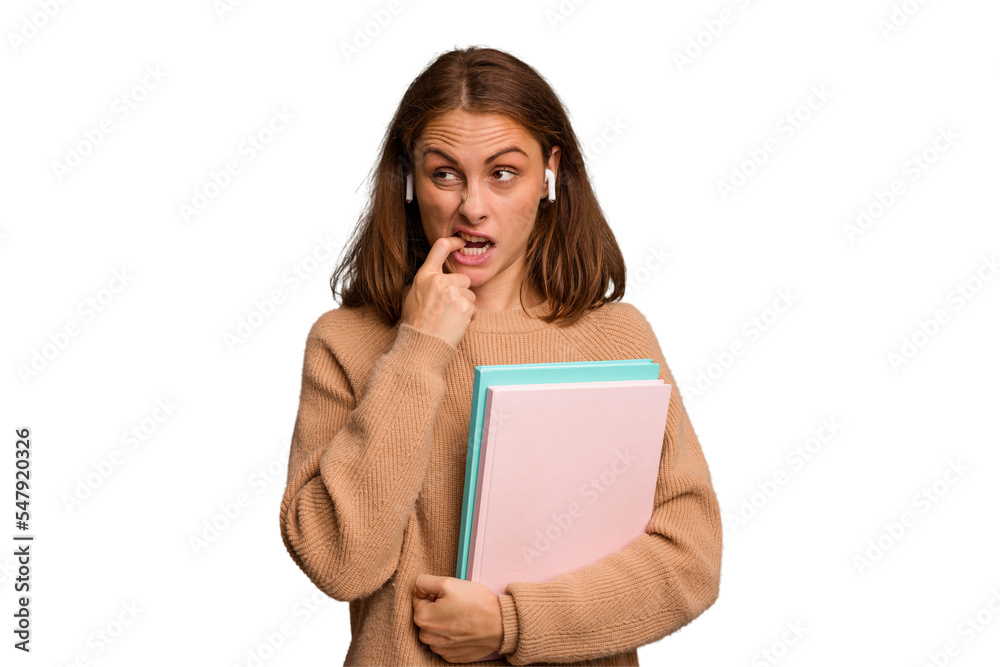 Young student woman holding a books isolated relaxed thinking about something looking at a copy space. Young student woman holding a books isolated relaxed thinking about something looking at a copy space.