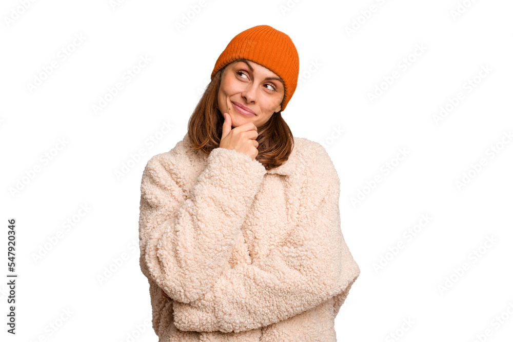 Young caucasian woman wearing winter clothes isolated looking sideways with doubtful and skeptical expression. Young caucasian woman wearing winter clothes isolated looking sideways with doubtful and skeptical expression.