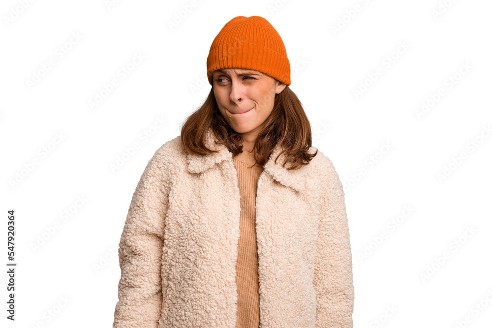 Young caucasian woman wearing winter clothes isolated confused, feels doubtful and unsure.