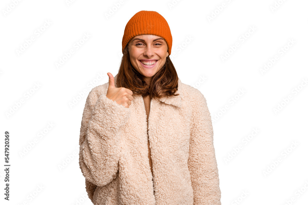 Young caucasian woman wearing winter clothes isolated smiling and raising thumb up