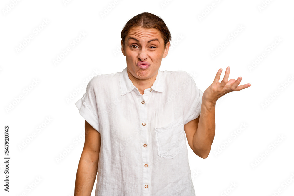 Young caucasian woman isolated doubting and shrugging shoulders in questioning gesture. Young caucasian woman isolated doubting and shrugging shoulders in questioning gesture.