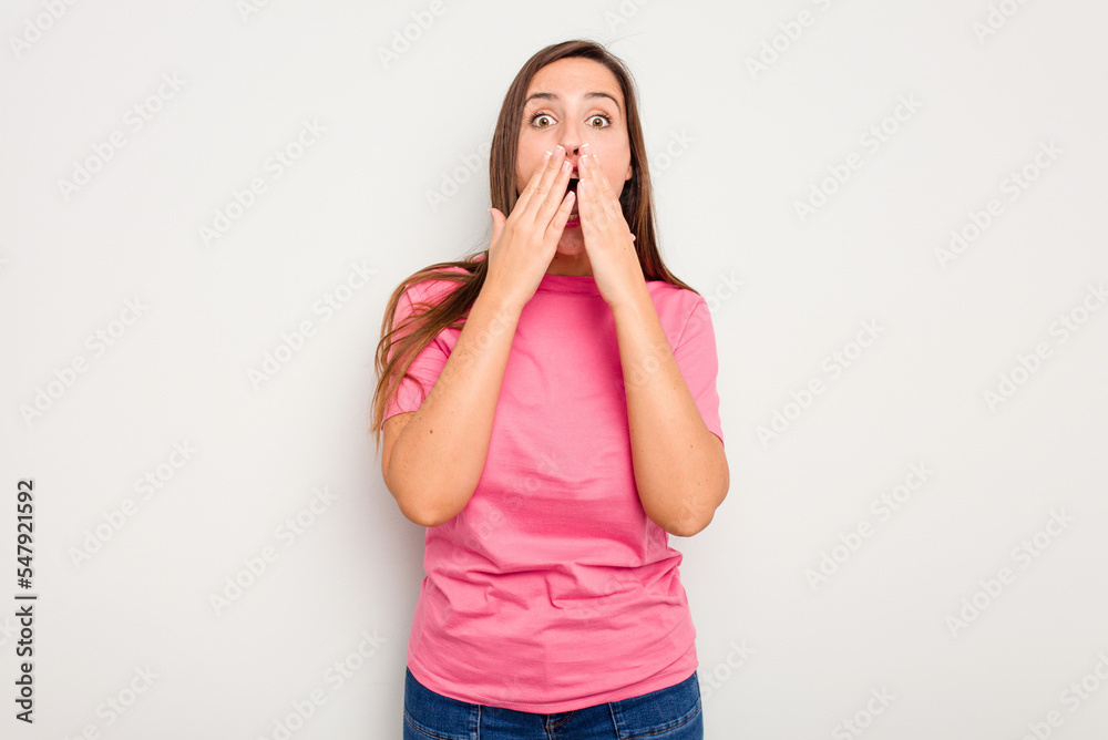 Young caucasian cute woman isolated on white background shocked covering mouth with hands. Young caucasian cute woman isolated on white background shocked covering mouth with hands.