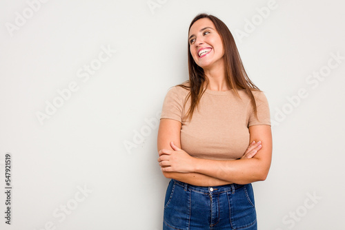 Young caucasian cute woman isolated on white background smiling confident with crossed arms.