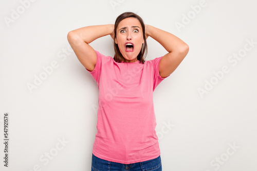 Young caucasian cute woman isolated on white background screaming with rage.
