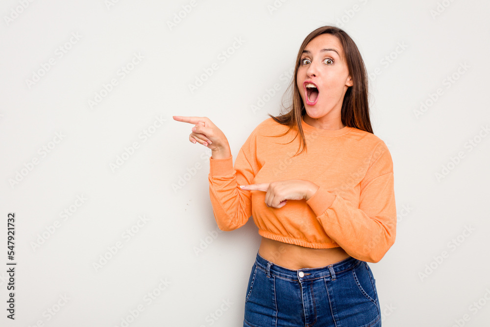 Young caucasian cute woman isolated on white background pointing with forefingers to a copy space, expressing excitement and desire. Young caucasian cute woman isolated on white background pointing with forefingers to a copy space, expressing excitement and desire.