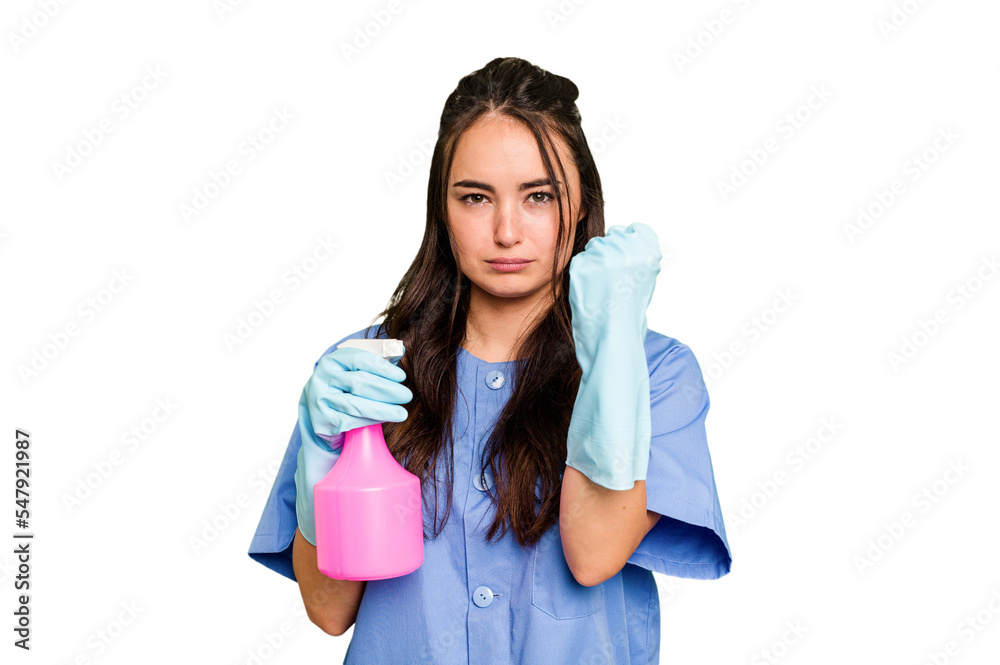 Young cleaner caucasian woman isolated on green chroma background showing fist to camera, aggressive facial expression. Young cleaner caucasian woman isolated on green chroma background showing fist to camera, aggressive facial expression.