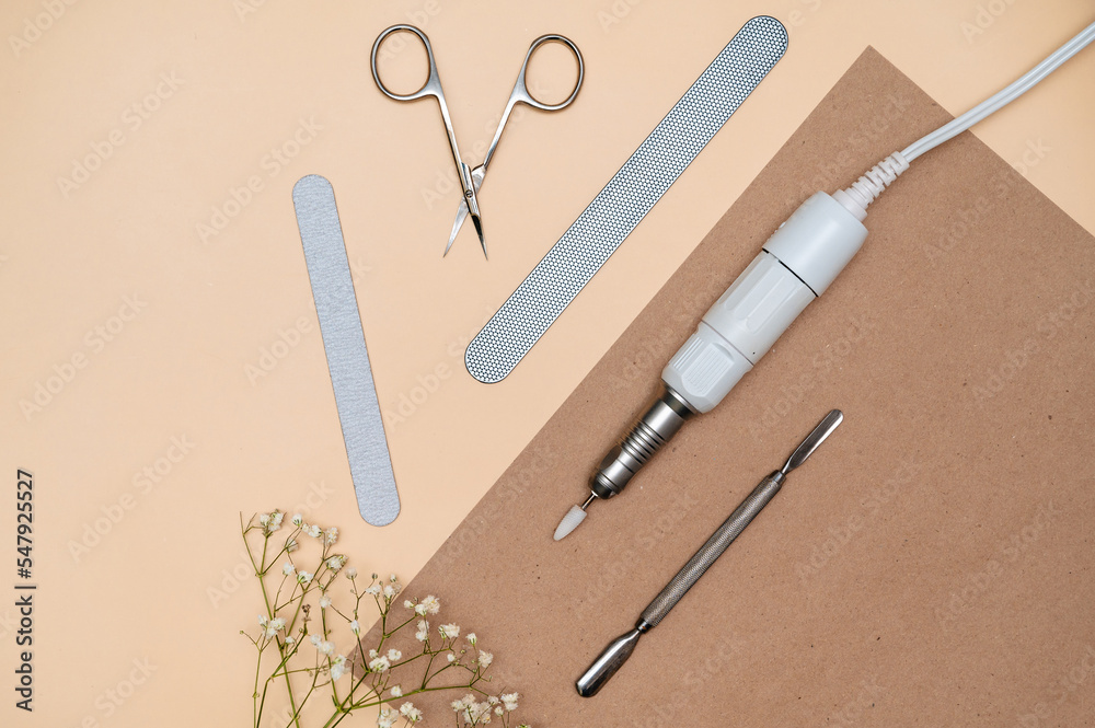 A set of tools for manicure and pedicure in a beauty salon. for business cards signage screensavers models banners beauty salons. flatlay A set of tools for manicure and pedicure in a beauty salon. for business cards signage screensavers models banners beauty salons. flatlay