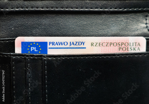 driving permit. Prawo jazdy portfel, Polish driving license in a black wallet. Polish and european union emblem. Driver's license in Poland in a leather wallet