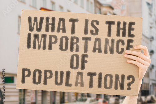 The question " What is the importance of population? " is on a banner in men's hands with blurred background. Future. Money. Prediction. Citizen. Career. Data. Directional. Generation. Evolution. Rise