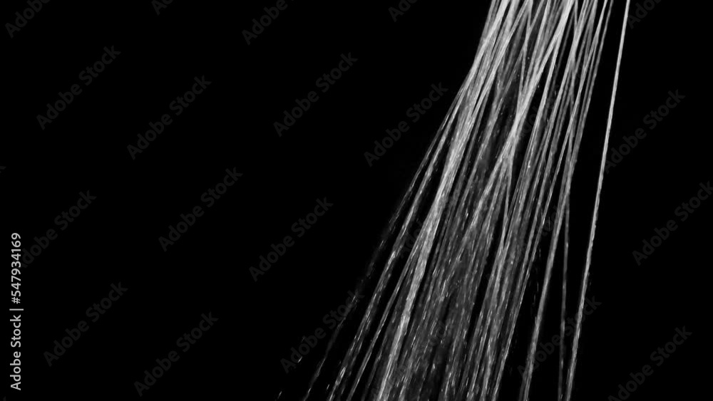 Water flows from the shower on a black background. Overlay template.