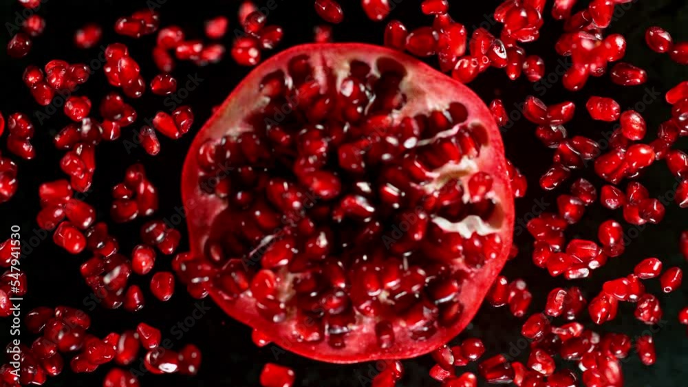 Fresh sliced pomegranate flying, super slow motion filmed on high speed cinematic camera at 1000 fps