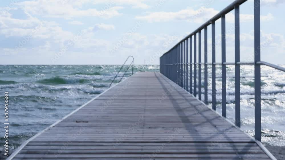 Jetty into the Baltic Sea at the beach of Hesselbjerg, Langeland, Denmark Jetty into the Baltic Sea at the beach of Hesselbjerg, Langeland, Denmark