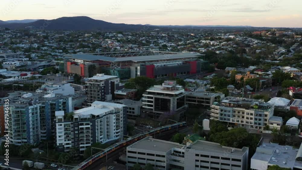 Establishing aerial shot capturing famous suncorp stadium in milton, inner city suburb with train crossing from merivale railway bridge and traffics on riverside expressway and Brisbane M3 highway. Establishing aerial shot capturing famous suncorp stadium in milton, inner city suburb with train crossing from merivale railway bridge and traffics on riverside expressway and Brisbane M3 highway.