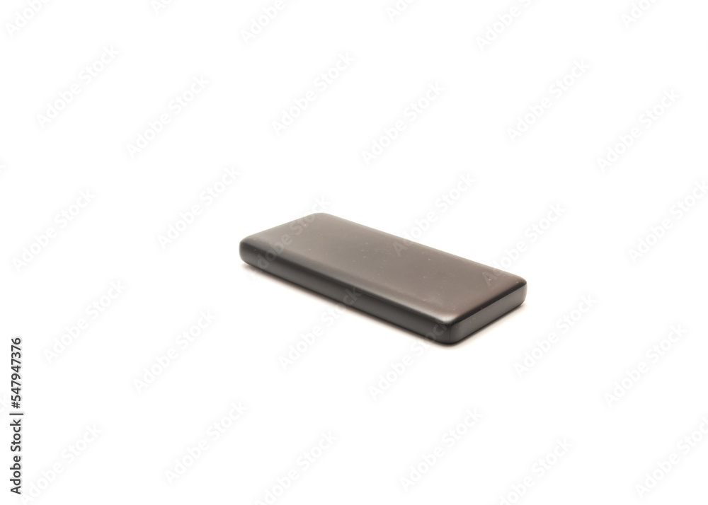 Black plastic covered compact power bank with ON/OFF button isolated on white background Black plastic covered compact power bank with ON/OFF button isolated on white background