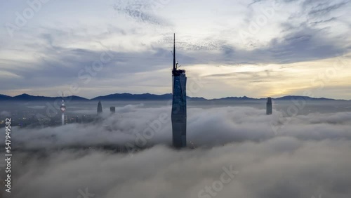 Aerial view hyperlapse 4k video of Kuala Lumpur city center view during dawn overlooking the city skyline in Federal Territory, Malaysia. Tilt up photo