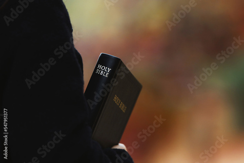 Obraz na plátně A Christian holding the Holy Bible and preaching the gospel of Jesus Christ and
