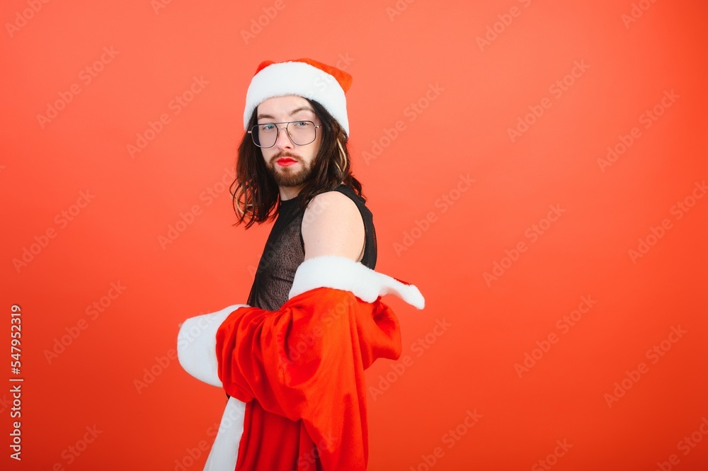New Year's gay party. A gay man in a Santa suit. Equality. LGBT community. New Year's gay party. A gay man in a Santa suit. Equality. LGBT community.