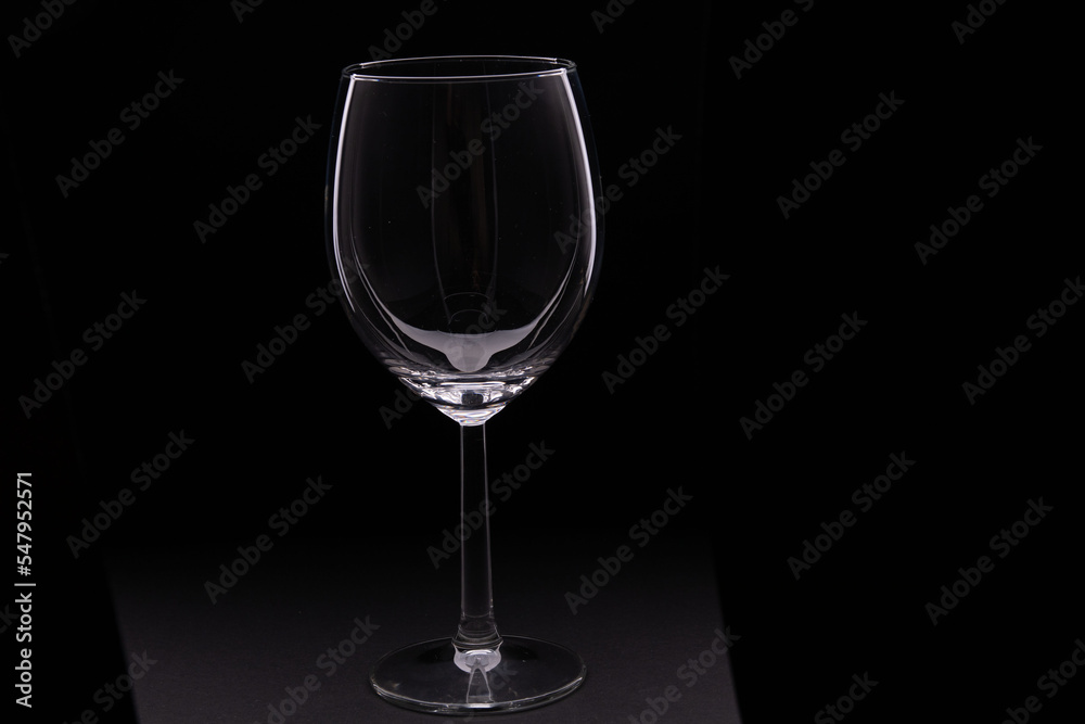 photo of an empty wine glass on a black background photo of an empty wine glass on a black background