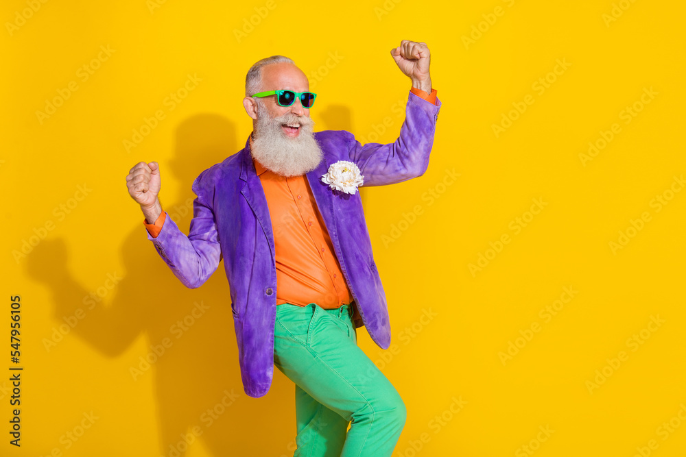 Photo of retired man raise fists have triumph in retro shopping sales isolated on shine color background