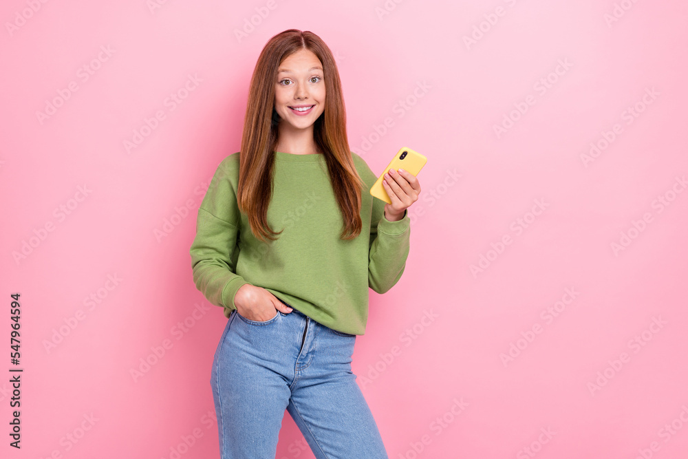 Photo of good mood optimistic girl straight hairdo green sweater twitter facebook instagram whatsapp isolated on pink color background Photo of good mood optimistic girl straight hairdo green sweater twitter facebook instagram whatsapp isolated on pink color background