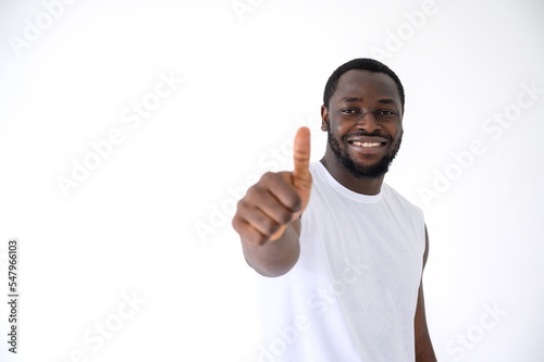 African American man showing thumbs up gesture with fitness clothes isolated over white. Healthy and Fitness concept.