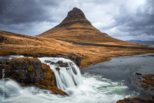 Kirkjufell mountain and Kirkjufellfoss waterfall  Snaefellsnes peninsula  Iceland. Long exposure shot in autumn.