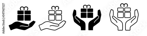 Gift in hand icons set. Hands holding gift box with ribbon icon. gift Box with ribbon vector icons. New year, birthday and Christmas. Vector EPS 10