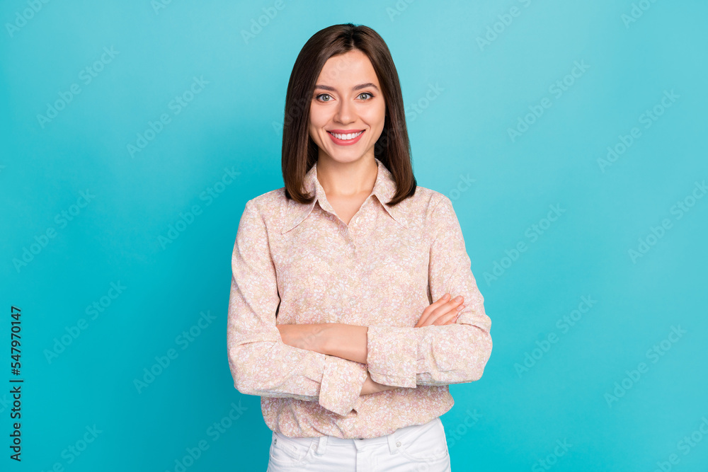 Photo portrait of charming young lady confident crossed arms dressed stylish smart casual clothes isolated on aquamarine color background Photo portrait of charming young lady confident crossed arms dressed stylish smart casual clothes isolated on aquamarine color background