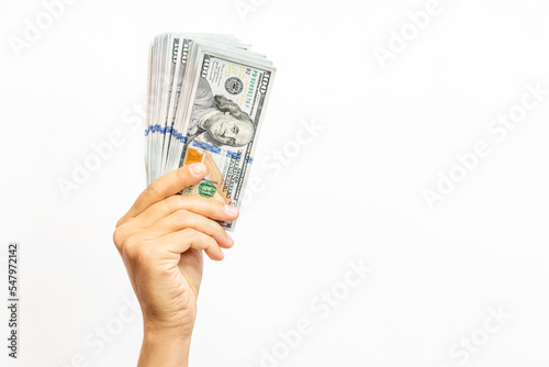 Hand with money - United States Dollars (or USD) on white background. Copy space for text