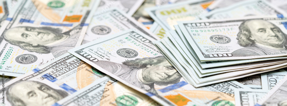 Dollars background. Much American money. Pile of new design US dollar bills. Currency, cash dollars. Finance, payment, trade, financial transactions concepts. Banner Dollars background. Much American money. Pile of new design US dollar bills. Currency, cash dollars. Finance, payment, trade, financial transactions concepts. Banner