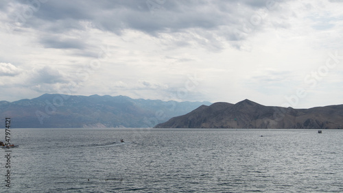 View of Privic Island and the Velebit mountains in the background from the Baska old town.