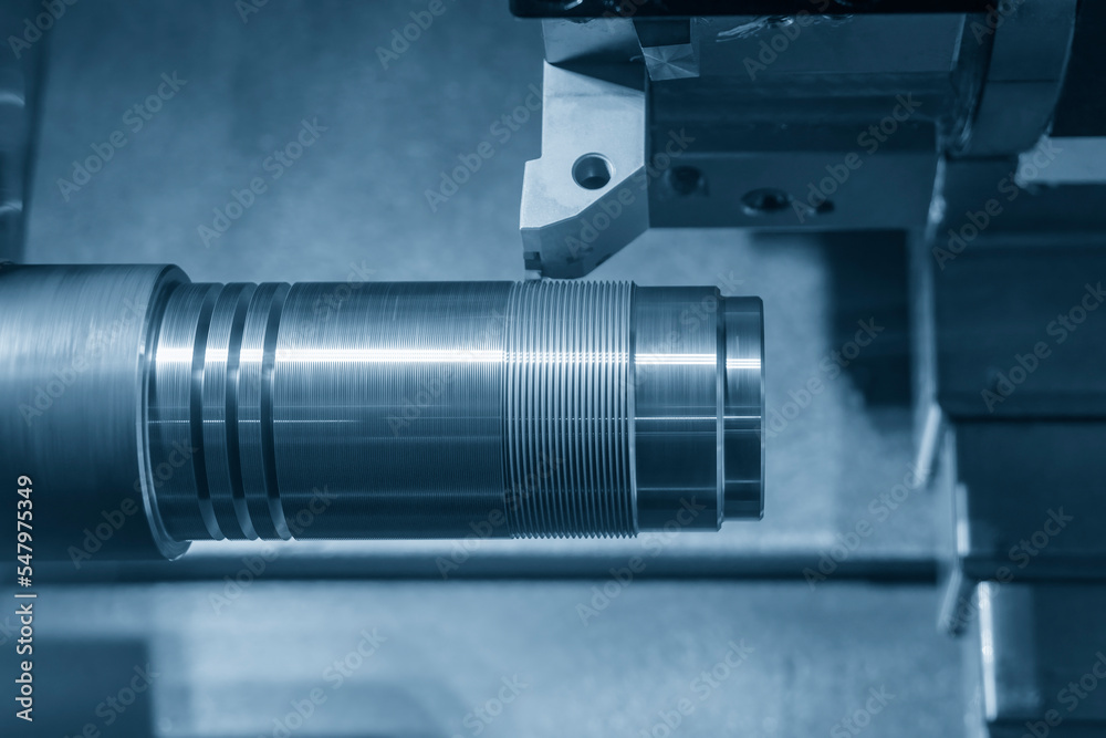 The CNC lathe machine thread cutting at the metal shaft parts. The CNC lathe machine thread cutting at the metal shaft parts.