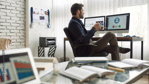Wallpaper Mural IT seller speak at video call on computer at desk Torontodigital.ca