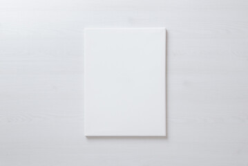 Vertical blank art canvas frame mockup for arts painting and photo presentation mockup. Laid on the floor