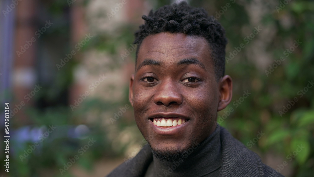 Happy satisfied black African portrait face close-up smile Happy satisfied black African portrait face close-up smile