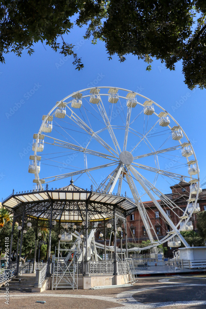 Fototapeta premium Christmas decorations. Ferris wheel in Piazza Garibaldi in the city center of Taranto, Puglia, Italy