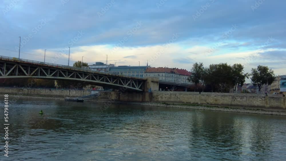 Riding along the Danube river in Budapest on a late afternoon in autumn Riding along the Danube river in Budapest on a late afternoon in autumn