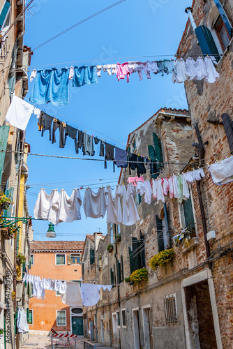 clothes on a clothesline in a narrow street in Venice © travelview